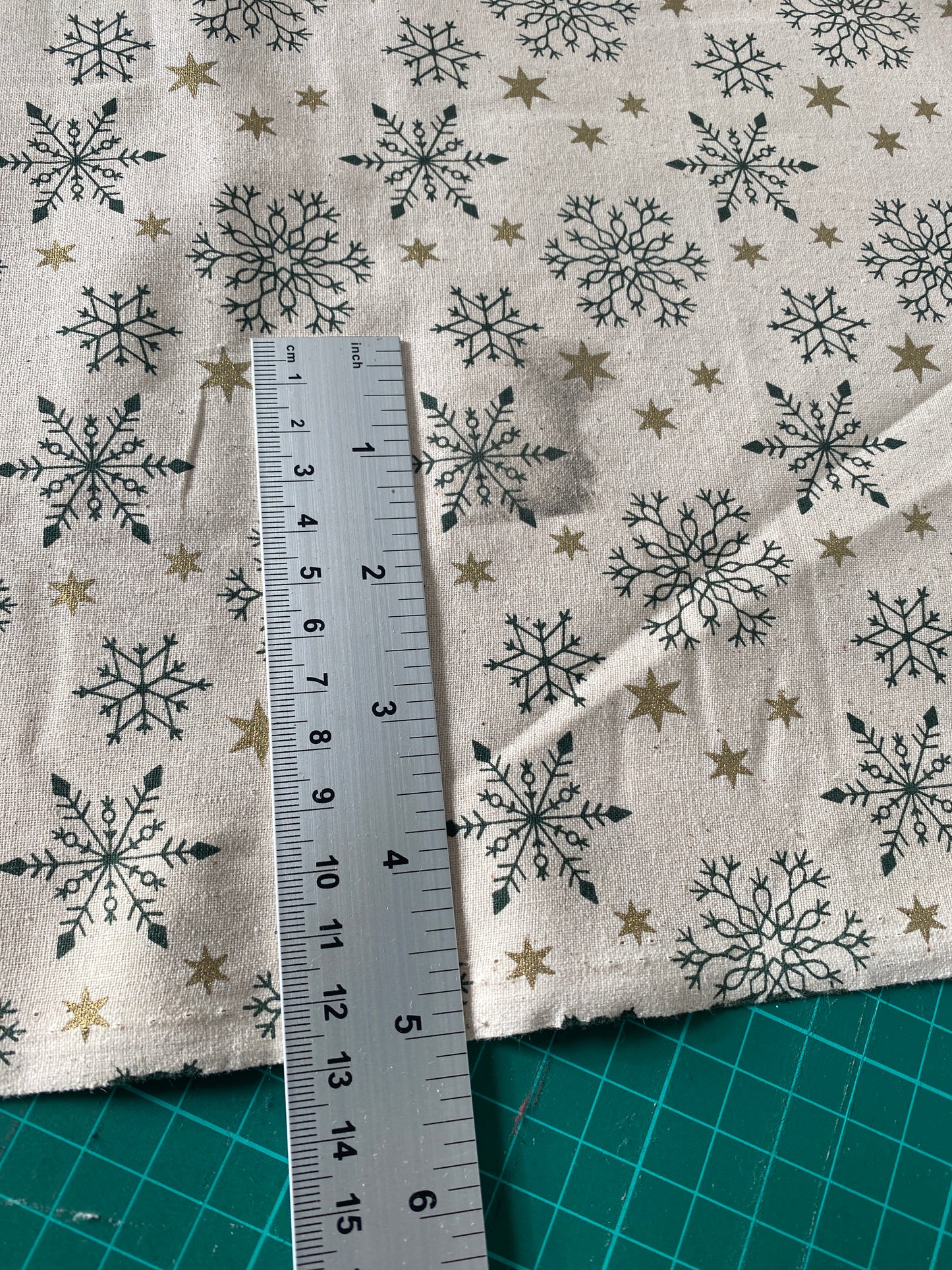 John Louden Christmas 100% Cotton Fabric - Scandi Green Snowflakes and Gold Stars on Natural Background