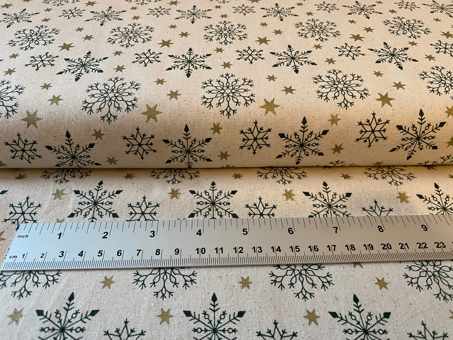 John Louden Christmas 100% Cotton Fabric - Scandi Green Snowflakes and Gold Stars on Natural Background