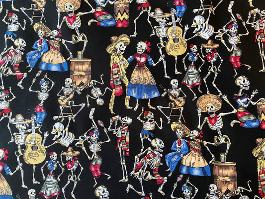 Fabric with colorful skeletons in traditional Mexican attire on a black background